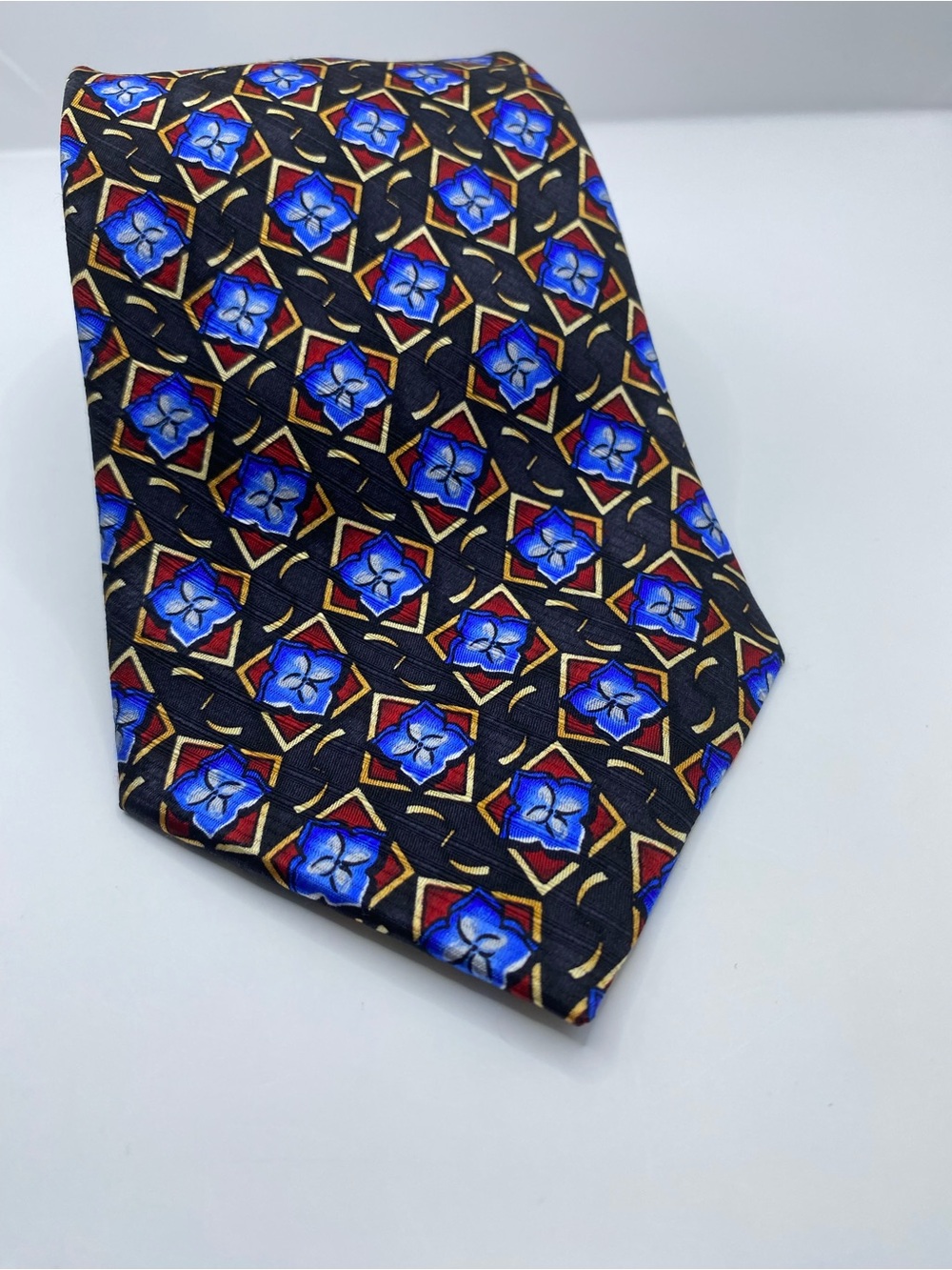 Zanzara Black Tie with Blue and Gold Geometric Floral Motif